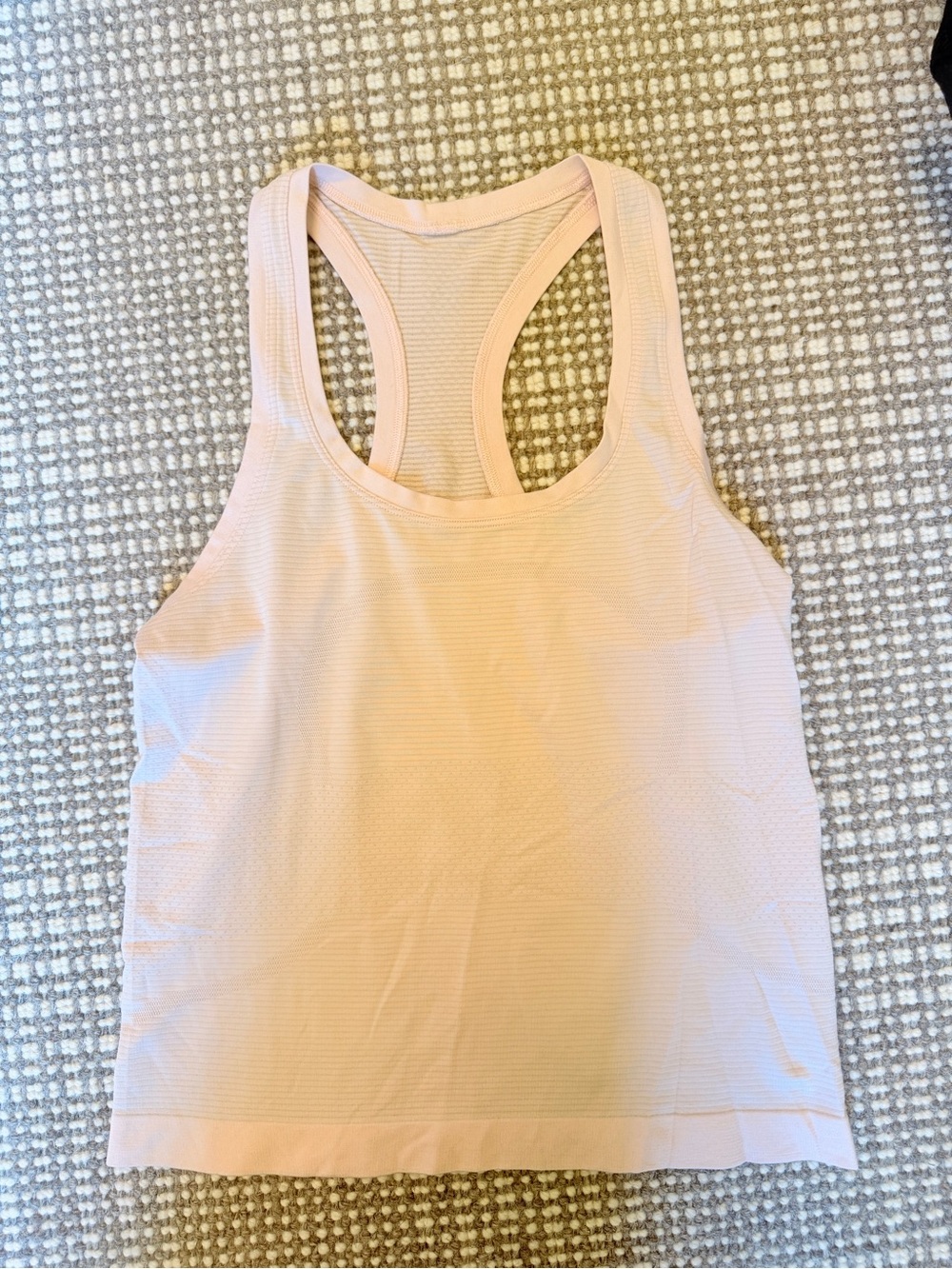 Women’s Lululemon Light Pink Swiftly Tank, hip length, size 4